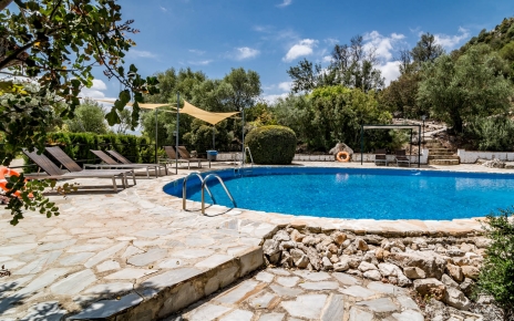 Four one-bedded cottages share this large pool